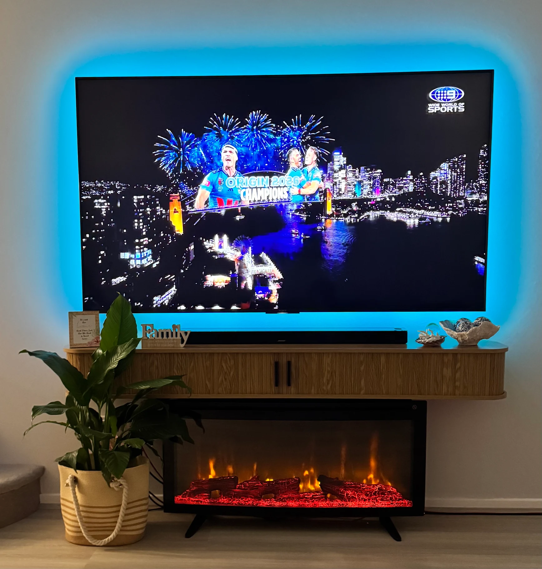 Wall mounted TV with fully concealed cables in a living room